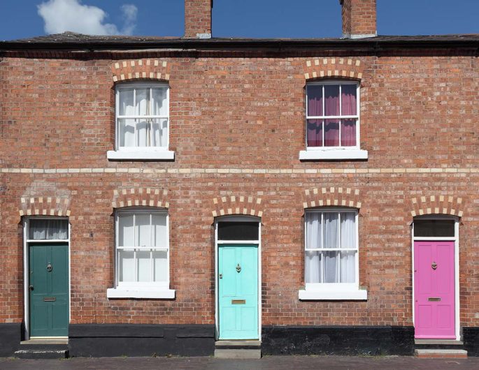 a row of painted houses to illustrate home improvements